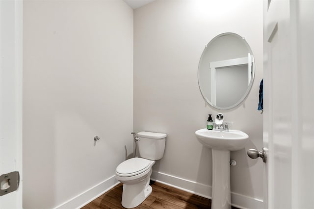 609 Cartmel, Greer, SC 29651 - bathroom with wood finished floors, toilet, baseboards, and a sink