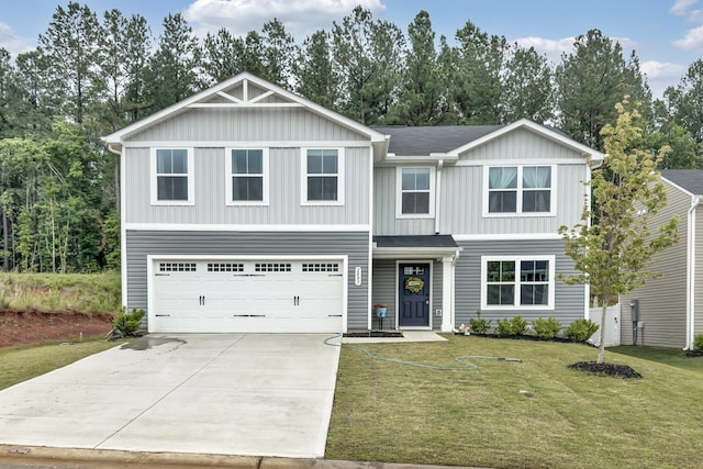 2097 Evanston, Wellford, SC 29385 - view of front facade featuring concrete driveway, board and batten siding, a front lawn, and a garage