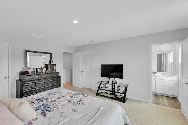 2097 Evanston, Wellford, SC 29385 - bedroom featuring light carpet, baseboards, ensuite bathroom, and recessed lighting
