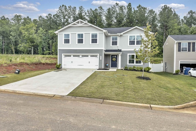 2097 Evanston, Wellford, SC 29385 - view of front of property featuring a garage, driveway, and board and batten siding