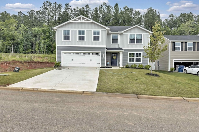 2097 Evanston, Wellford, SC 29385 - view of front facade featuring a garage, driveway, a front yard, and board and batten siding
