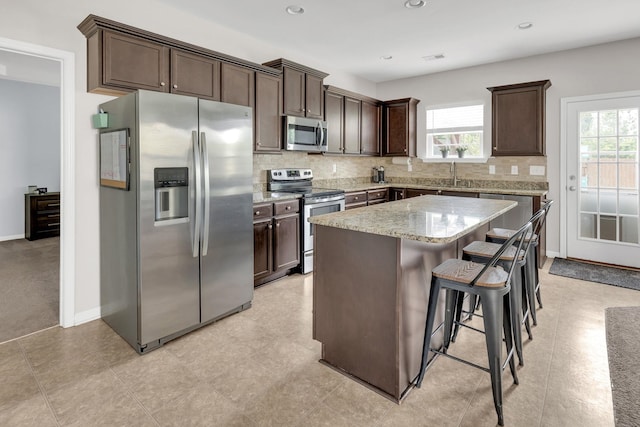 241 Hartleigh, Lyman, SC 29365 - kitchen featuring appliances with stainless steel finishes, dark brown cabinets, decorative backsplash, and recessed lighting