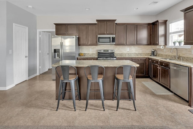 241 Hartleigh, Lyman, SC 29365 - kitchen featuring stainless steel appliances, a sink, a center island, and dark brown cabinetry