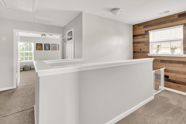 241 Hartleigh, Lyman, SC 29365 - hallway featuring carpet flooring, wooden walls, and baseboards