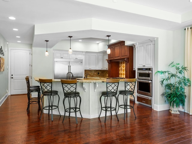220 Fincher, Pauline, SC 29374 - kitchen with stainless steel appliances, a warming drawer, dark wood-style flooring, recessed lighting, and baseboards