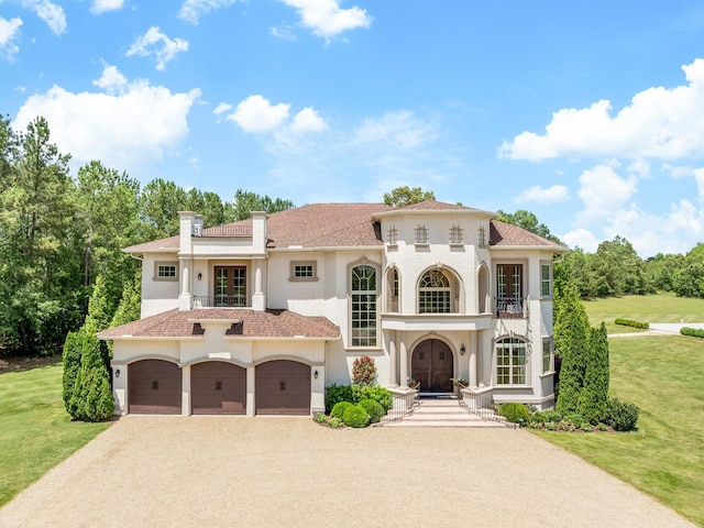 220 Fincher, Pauline, SC 29374 - mediterranean / spanish home featuring a balcony, stucco siding, a front lawn, and a garage