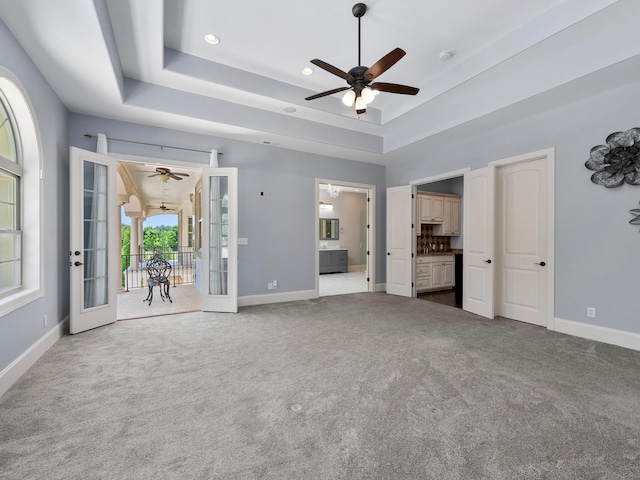 220 Fincher, Pauline, SC 29374 - unfurnished living room featuring a ceiling fan, french doors, a tray ceiling, baseboards, and recessed lighting