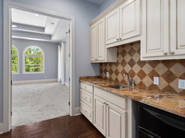 220 Fincher, Pauline, SC 29374 - kitchen featuring a sink, baseboards, light stone counters, decorative backsplash, and dark carpet