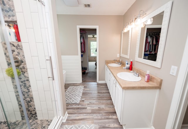 477 Cresthaven, Boiling Springs, SC 29316 - bathroom with wood finished floors, a shower stall, double vanity, a spacious closet, and a soaking tub