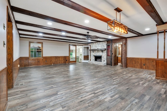 268 Margate, Chesnee, SC 29323 - unfurnished living room with a wainscoted wall, wood walls, a ceiling fan, beamed ceiling, and wood finished floors