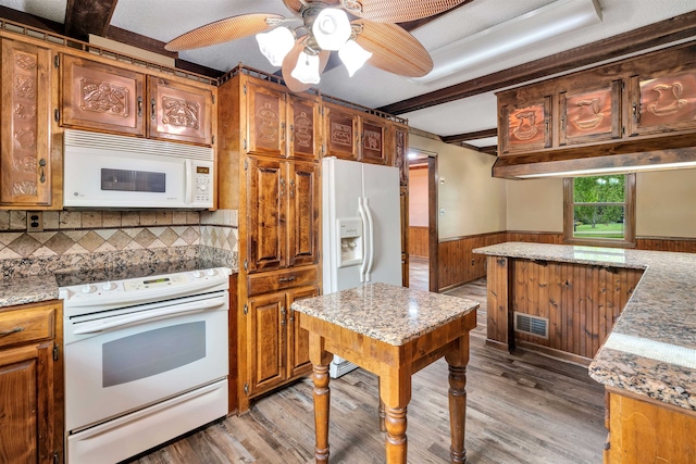 268 Margate, Chesnee, SC 29323 - kitchen featuring white appliances, wainscoting, light wood finished floors, ceiling fan, and brown cabinetry