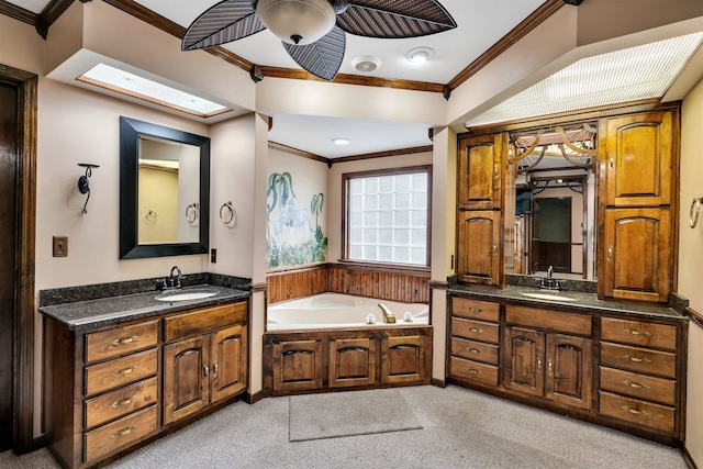268 Margate, Chesnee, SC 29323 - bathroom with crown molding, two vanities, ceiling fan, a bath, and a skylight