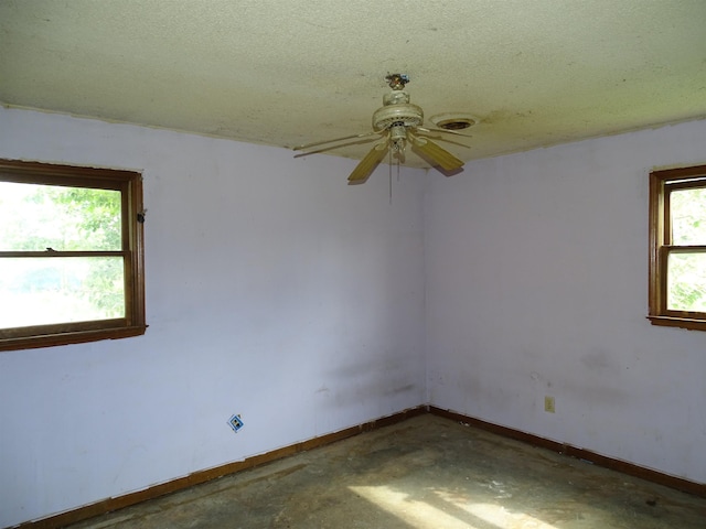 218 Wingo, Wellford, SC 29385 - unfurnished room with ceiling fan, concrete flooring, and a textured ceiling