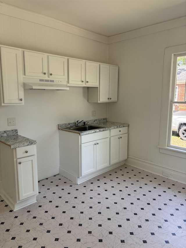 112 Scruggs, Spartanburg, SC 29303 - kitchen with under cabinet range hood, white cabinets, and light floors