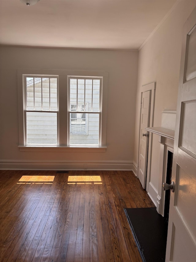 112 Scruggs, Spartanburg, SC 29303 - unfurnished living room with dark wood-style flooring and crown molding