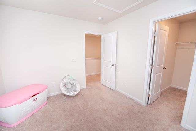 923 Porch Song, Inman, SC 29349 - unfurnished bedroom with carpet floors, attic access, and a walk in closet