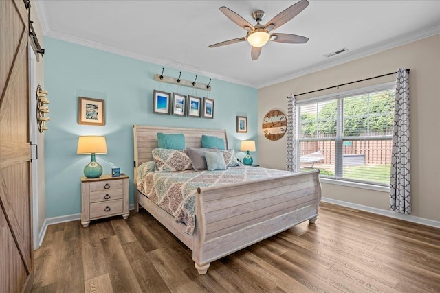 1044 Merlot, Moore, SC 29369 - bedroom featuring wood finished floors, a barn door, ornamental molding, and ceiling fan