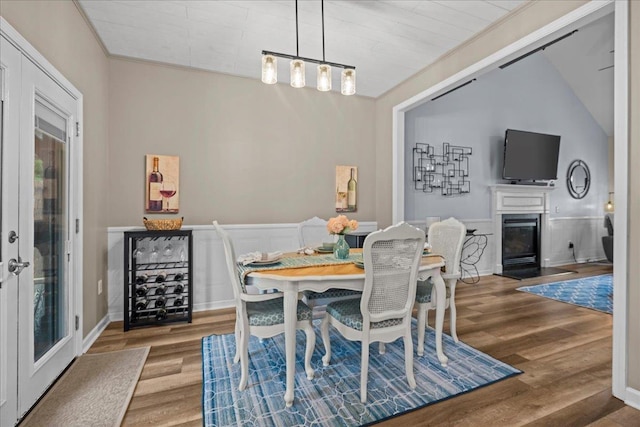 1044 Merlot, Moore, SC 29369 - dining space featuring wood finished floors, wainscoting, and a fireplace with flush hearth