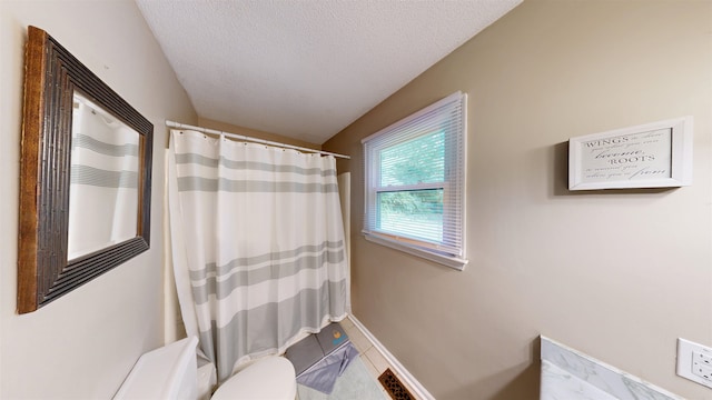 181 Peach, Inman, SC 29349 - bathroom featuring curtained shower, a textured ceiling, and tile patterned floors