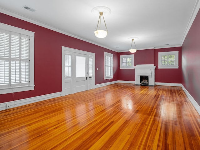 772 Glendalyn, Spartanburg, SC 29302 - unfurnished living room with hardwood / wood-style flooring, a brick fireplace, and crown molding