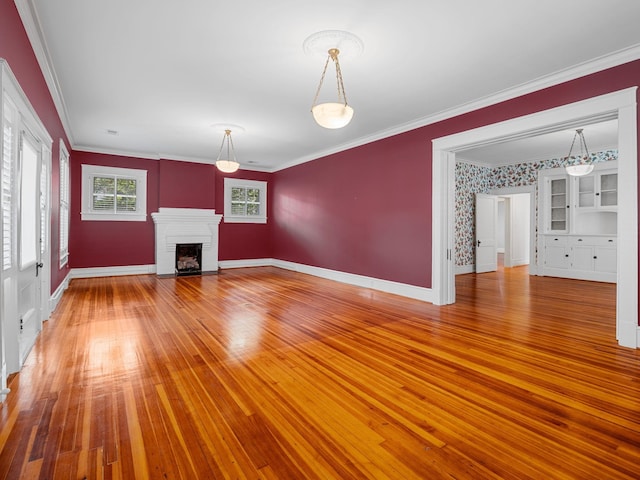 772 Glendalyn, Spartanburg, SC 29302 - unfurnished living room with ornamental molding, a fireplace, and light wood-style floors