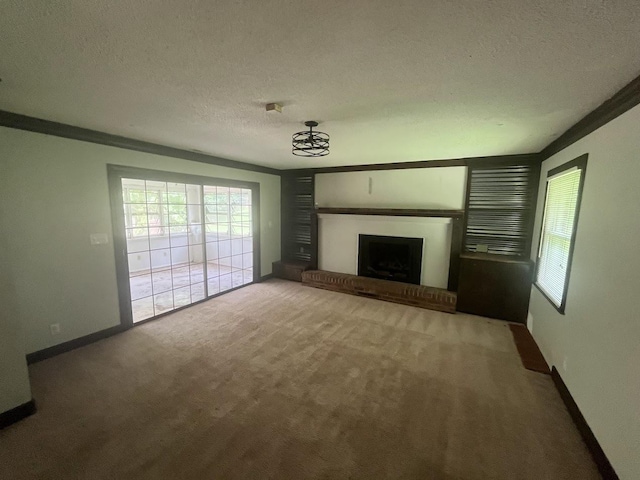 119 Hillside Dr, Gaffney, SC 29340 - unfurnished living room with carpet, a textured ceiling, healthy amount of natural light, and a brick fireplace