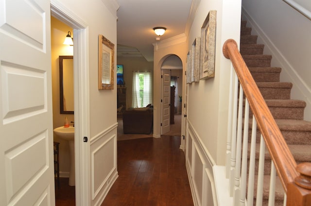 108 Dillard Crk, Greer, SC 29651 - hall featuring crown molding, dark wood-type flooring, stairs, and arched walkways