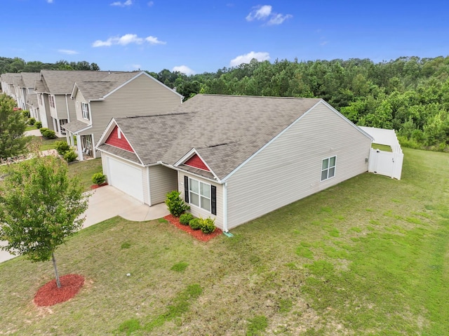 259 Millen, Woodruff, SC 29388 - view of property exterior with a shingled roof, a garage, driveway, and a lawn