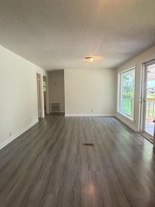 121 Hillside Dr, Spartanburg, SC 29303 - unfurnished living room with dark wood-type flooring and a textured ceiling