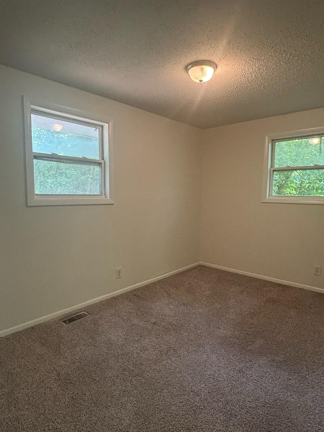 121 Hillside Dr, Spartanburg, SC 29303 - carpeted spare room with a textured ceiling and baseboards