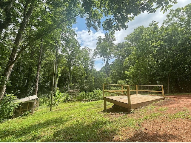 121 Hillside Dr, Spartanburg, SC 29303 - view of grassy yard featuring a deck and a forest view