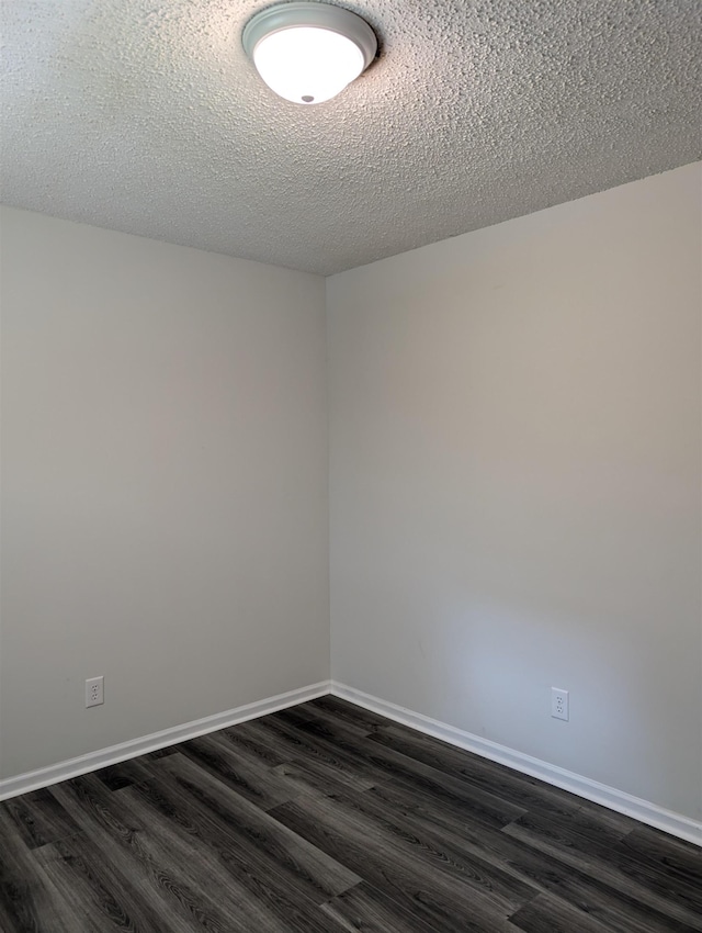 126 Loblolly, Wellford, SC 29385 - empty room featuring dark wood-style flooring and a textured ceiling
