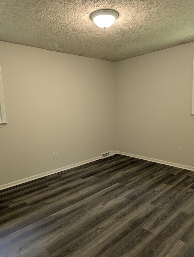 126 Loblolly, Wellford, SC 29385 - spare room featuring a textured ceiling and dark wood finished floors