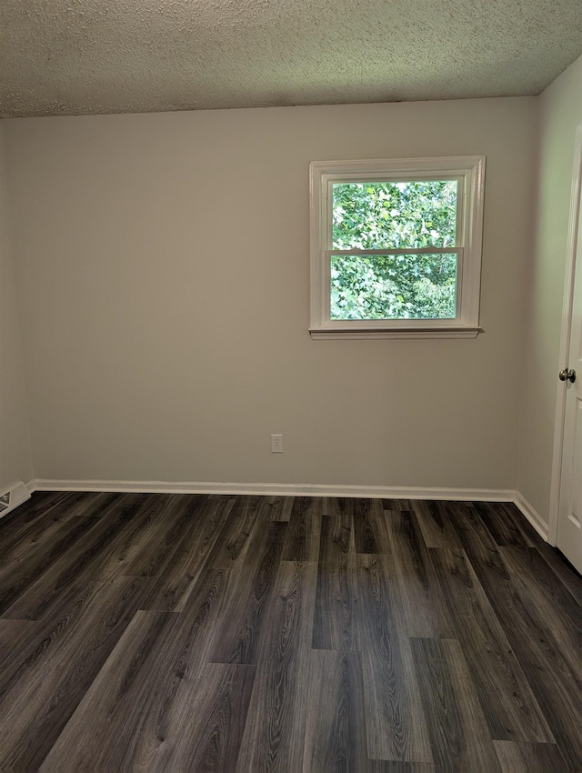 126 Loblolly, Wellford, SC 29385 - spare room featuring dark wood-style floors and a textured ceiling