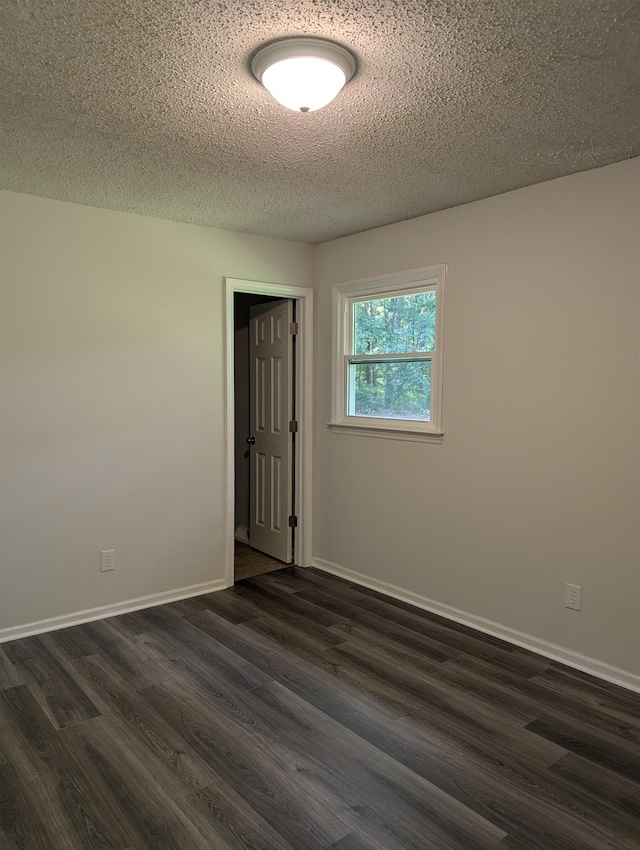126 Loblolly, Wellford, SC 29385 - spare room with dark wood-style floors and a textured ceiling