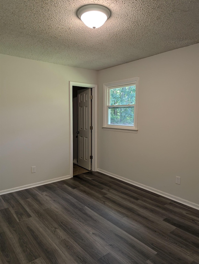 126 Loblolly, Wellford, SC 29385 - empty room with dark wood-style floors and a textured ceiling
