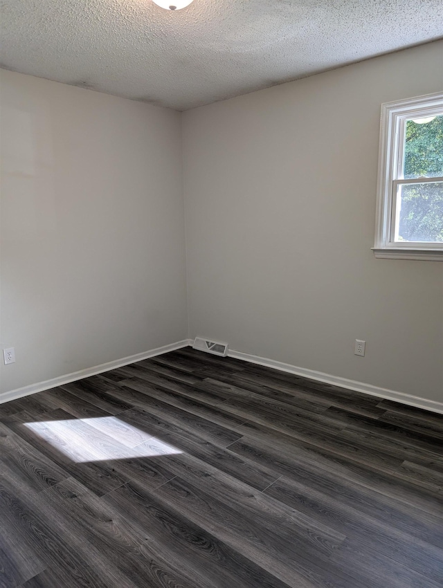 126 Loblolly, Wellford, SC 29385 - spare room with dark wood finished floors and a textured ceiling