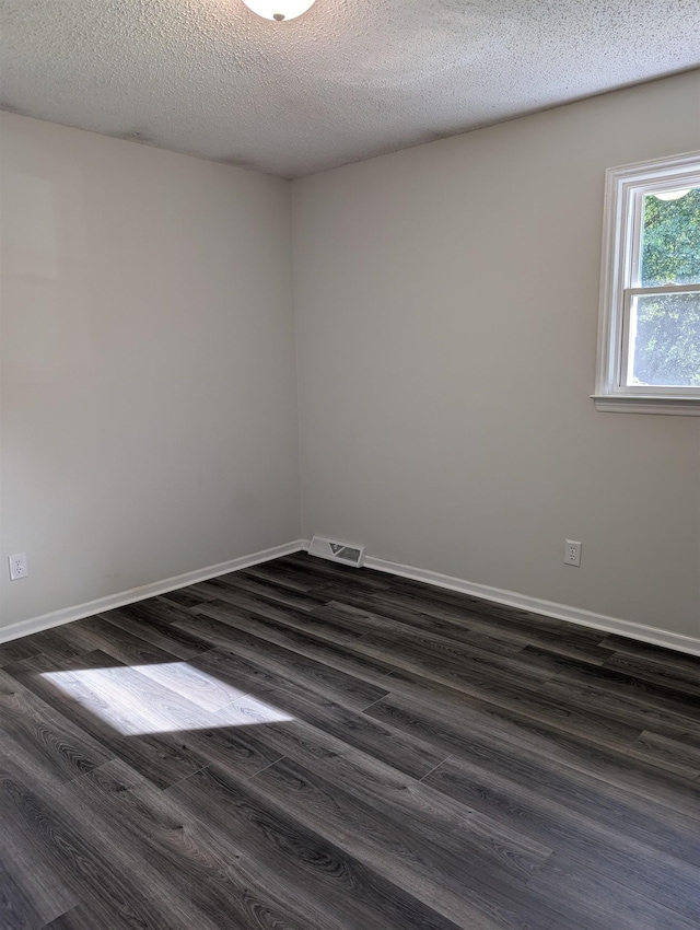 126 Loblolly, Wellford, SC 29385 - unfurnished room with dark wood-style floors and a textured ceiling