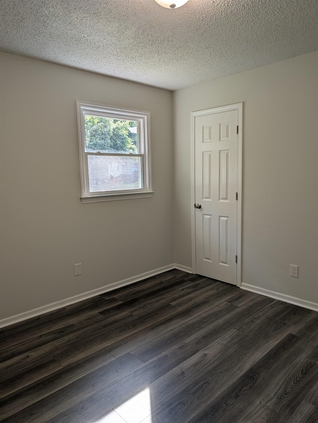 126 Loblolly, Wellford, SC 29385 - spare room featuring dark wood-style floors and a textured ceiling