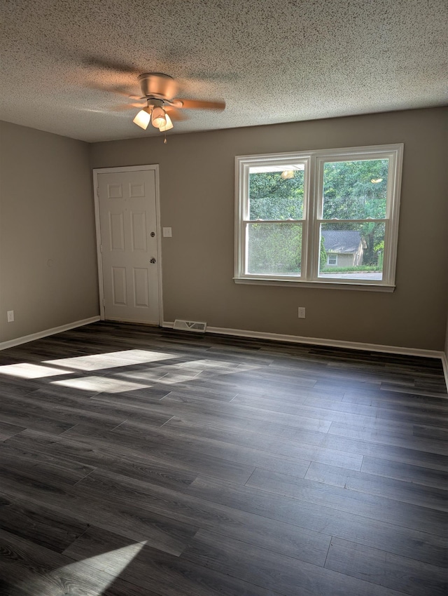 126 Loblolly, Wellford, SC 29385 - spare room featuring dark wood-style floors, a ceiling fan, and a textured ceiling