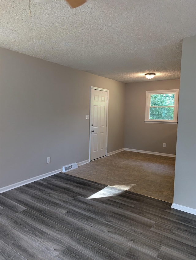 126 Loblolly, Wellford, SC 29385 - unfurnished room with dark wood-style flooring and a textured ceiling