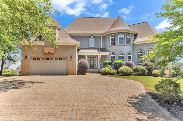 410 Anchorage, Inman, SC 29349 - view of front of property with decorative driveway, stucco siding, and brick siding