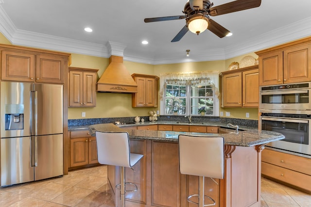 410 Anchorage, Inman, SC 29349 - kitchen with stainless steel appliances, custom exhaust hood, a breakfast bar area, light tile patterned flooring, and crown molding