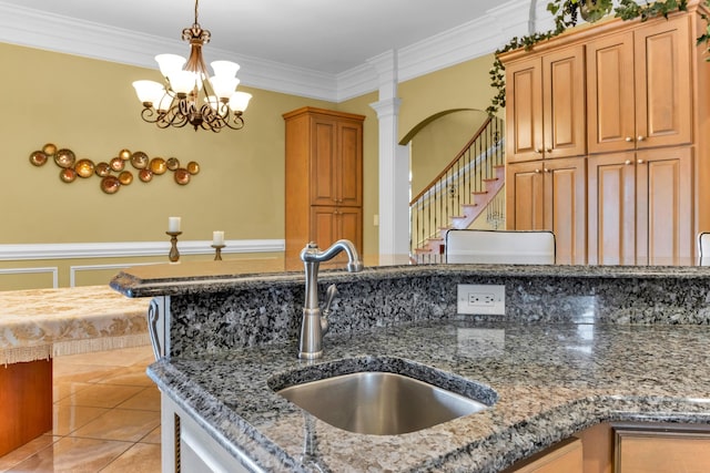 410 Anchorage, Inman, SC 29349 - kitchen featuring decorative light fixtures, crown molding, light tile patterned floors, a chandelier, and stone countertops
