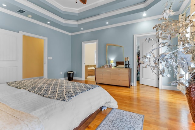 410 Anchorage, Inman, SC 29349 - bedroom featuring light wood finished floors, crown molding, recessed lighting, a tray ceiling, and a spacious closet