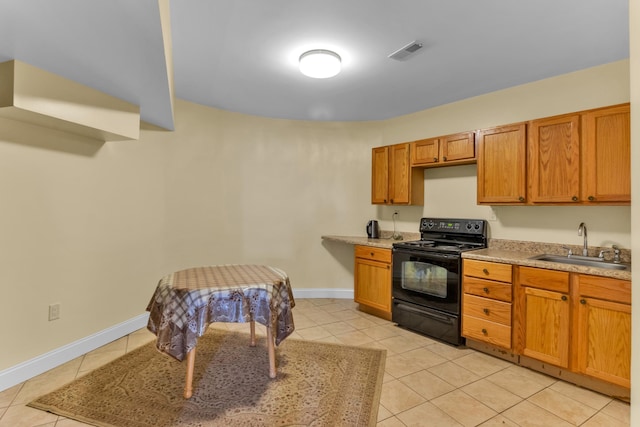 410 Anchorage, Inman, SC 29349 - kitchen featuring black electric range oven, light tile patterned floors, brown cabinets, and light countertops