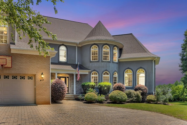 410 Anchorage, Inman, SC 29349 - view of front of home with decorative driveway, stucco siding, a shingled roof, and brick siding