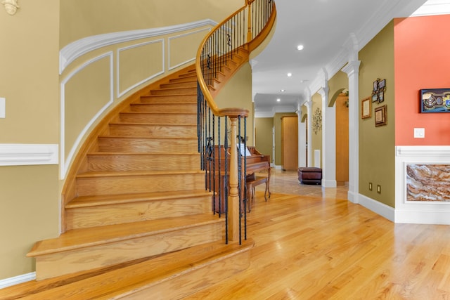 410 Anchorage, Inman, SC 29349 - stairs with wood finished floors, recessed lighting, ornamental molding, arched walkways, and decorative columns