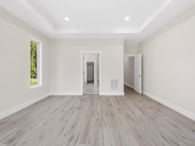 162 Clearcreek, Boiling Springs, SC 29316 - unfurnished bedroom featuring a raised ceiling, light wood finished floors, recessed lighting, and a walk in closet