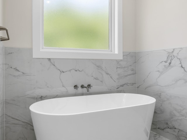 162 Clearcreek, Boiling Springs, SC 29316 - full bathroom with tile walls, marble finish flooring, a freestanding tub, and wainscoting